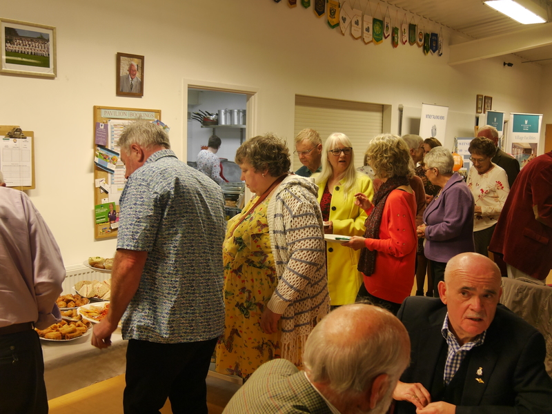 Listeners and volunteers queue for the buffet. Let the feasting begin!