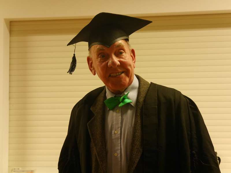 Reader Alan Bailey in costume as a school master for his monologue, “Many Happy Returns”