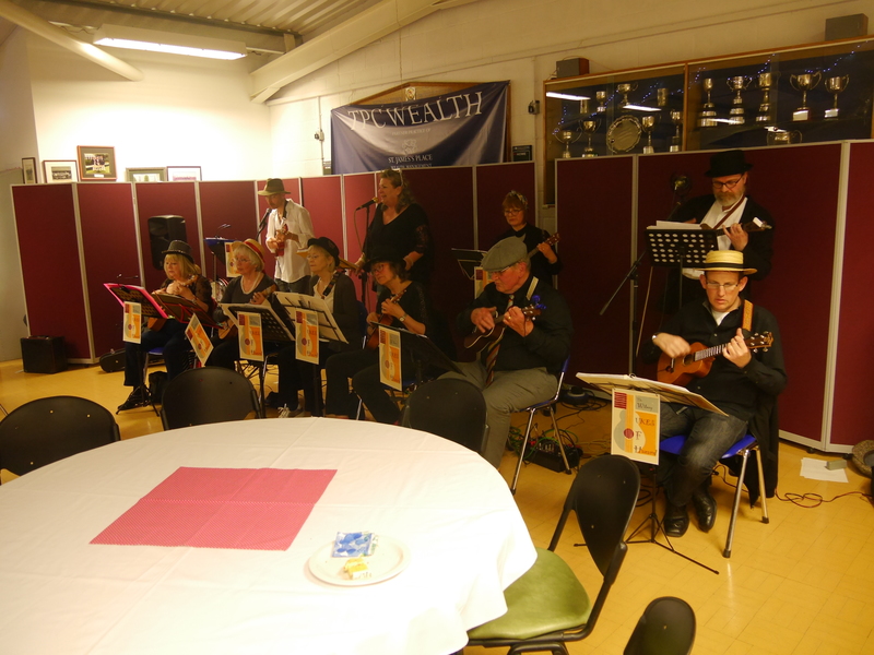 Ukulele band, Witney Ukes Of Hazard, begin their performance.