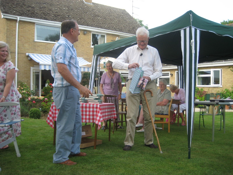 WTN Chairman presents Lord Hurd with a card and gift bag containing a small token of appreciation for his kind support.